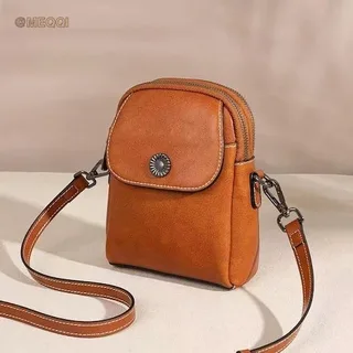 Oiled leather vertical mini crossbody bag in black